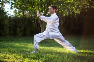 Man Performing Tai Chi for Flexibility, One of The Components of Physical Fitness